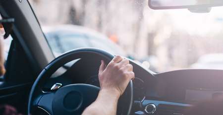 A man in a car driving A man in a car driving