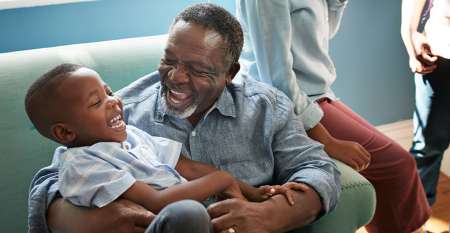 Man and young boy laughing Man and young boy laughing