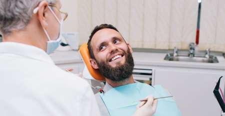 Smiling man in dental chair
