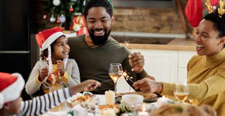 Young family enjoying Christmas lunch Young family enjoying Christmas lunch