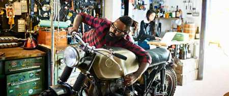 Man fixing motorbike