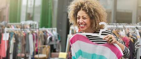 Young woman buying a dress