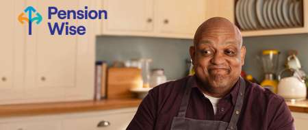 Pension Wise man in kitchen smiling